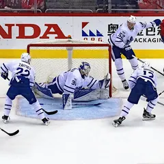 Maple Leafs players in front of their net